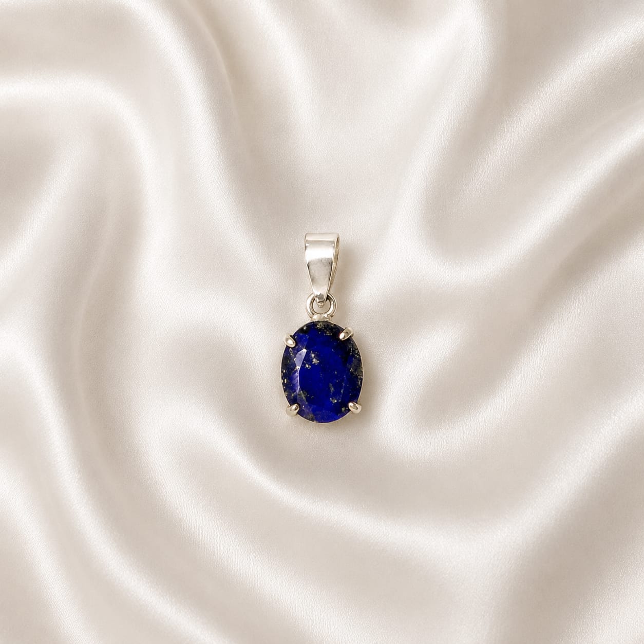 "Genuine Lapis Lazuli crystal pendant featuring a deep blue natural gemstone with golden flecks, elegantly crafted for everyday wear, spiritual jewelry, and meaningful gifting."