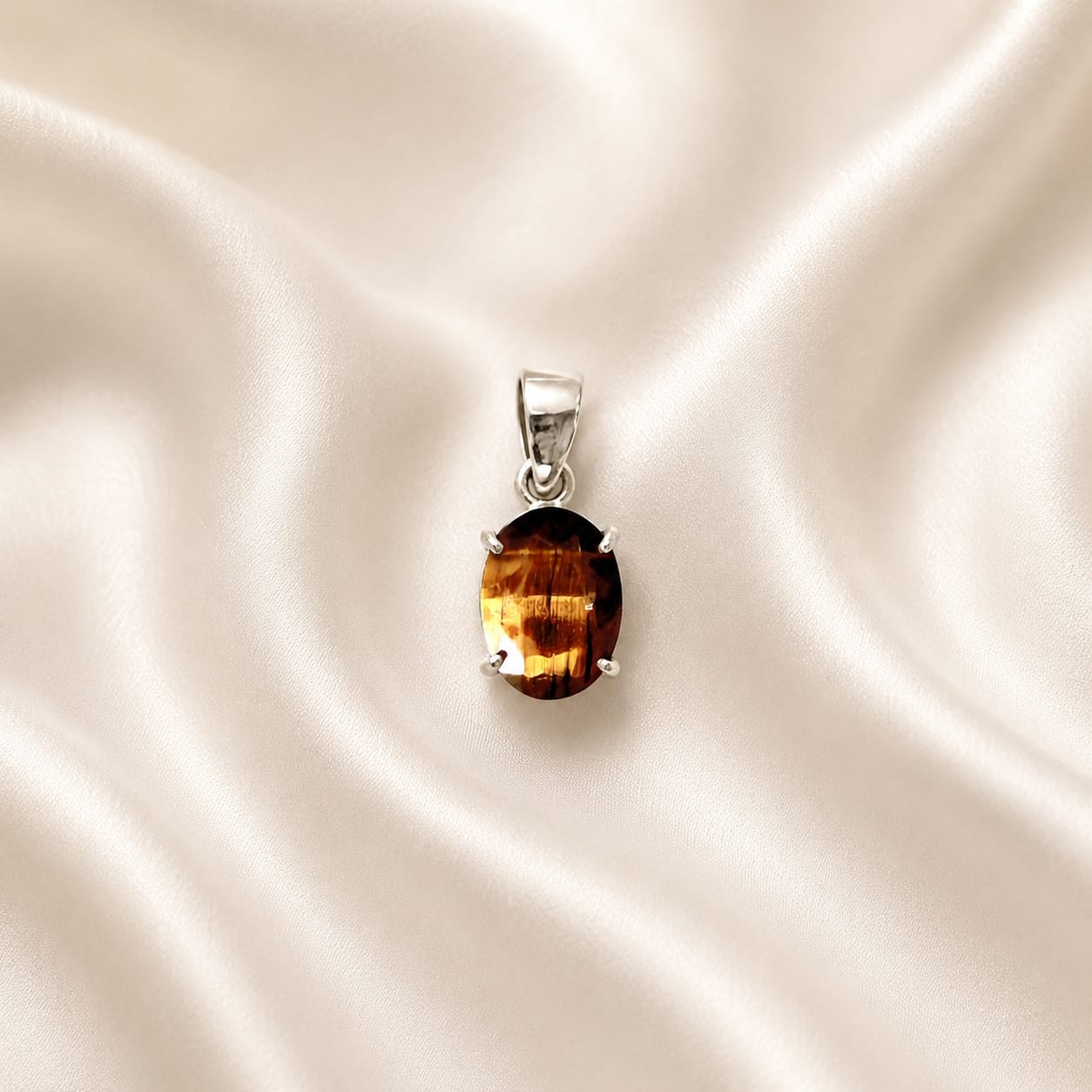 "Natural Tiger Eye crystal pendant featuring a polished golden-brown gemstone with distinctive bands, elegantly crafted for everyday wear, confidence, focus, and stylish spiritual jewelry."