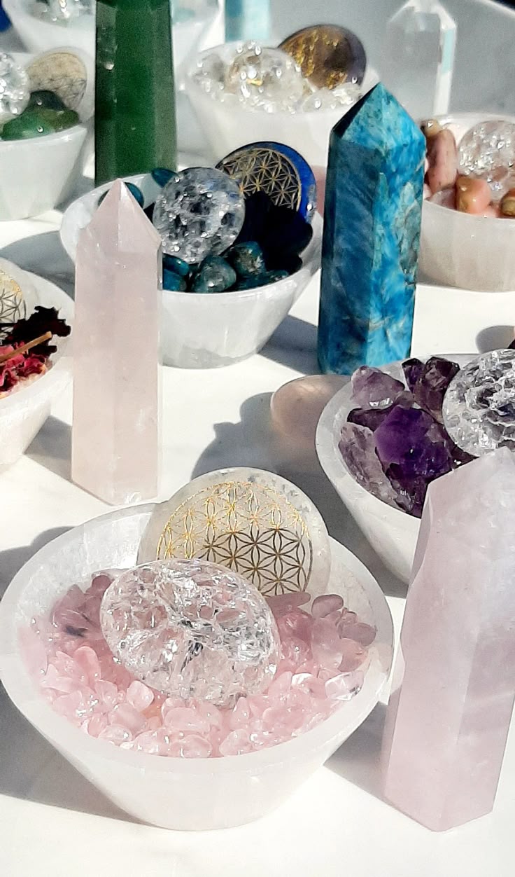 "Collection of assorted crystal products including crystal pyramids, spheres, raw stones, geodes, wands, keychains, candle holders, tumble stones, and decorative spiritual accessories crafted from genuine natural crystals."