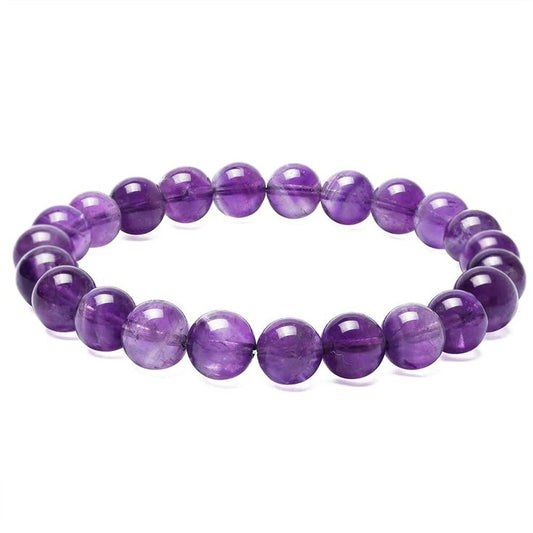 Amethyst crystal bracelet featuring polished purple gemstone beads strung on a durable elastic cord. Known for its calming energy, Amethyst is associated with peace, spiritual growth, mental clarity, and protection. Stylish, comfortable, and perfect for everyday wear