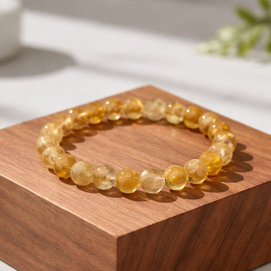 Citrine crystal bracelet featuring polished golden-yellow gemstone beads strung on a durable elastic cord. Known as the stone of abundance, Citrine is associated with prosperity, confidence, positivity, and success. Bright, elegant, and perfect for everyday wear.