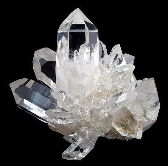 Natural Clear Quartz raw crystal featuring a transparent to translucent appearance with rough, unpolished surfaces and unique natural formations. Known as the “Master Healer,” Clear Quartz is associated with clarity, energy amplification, focus, and spiritual growth.