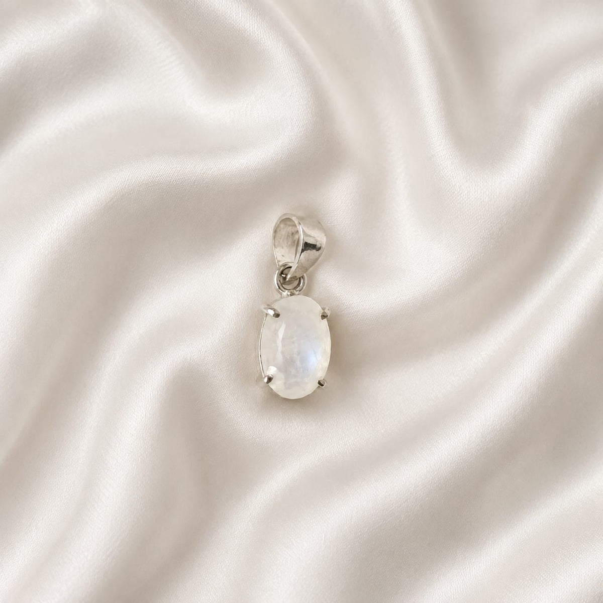 "Natural Moonstone crystal pendant featuring a luminous gemstone with an iridescent glow, elegantly crafted for everyday wear, emotional balance, intuition, and stylish spiritual jewelry."
