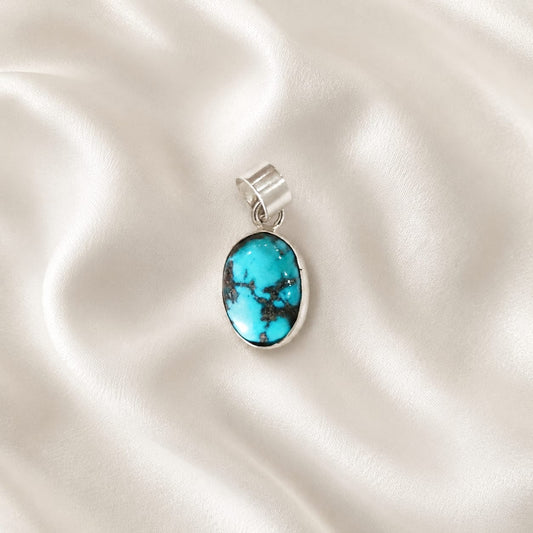 "Natural Blue Turquoise crystal pendant featuring a vibrant sky-blue gemstone with unique patterns, elegantly crafted for everyday wear, emotional balance, communication, and stylish spiritual jewelry."